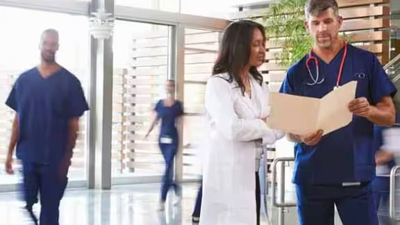 Doctors checking report