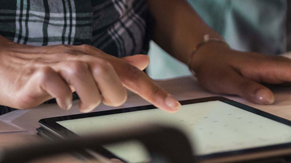 man working on tablet